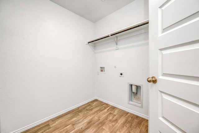 laundry area featuring washer hookup, light wood-type flooring, hookup for a gas dryer, and hookup for an electric dryer