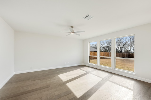 spare room with ceiling fan and wood-type flooring