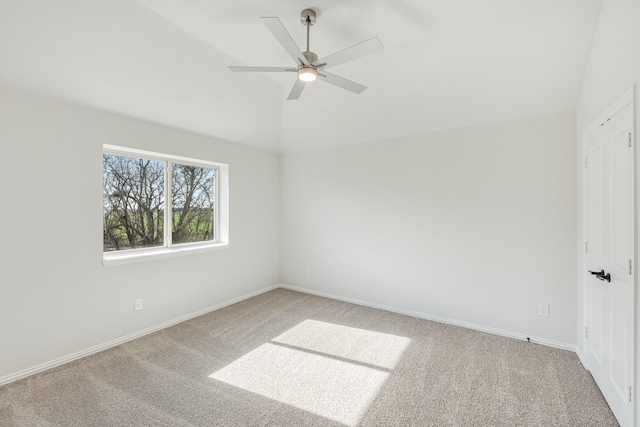 unfurnished room with ceiling fan, carpet, and vaulted ceiling