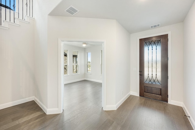 entryway with ceiling fan and wood-type flooring