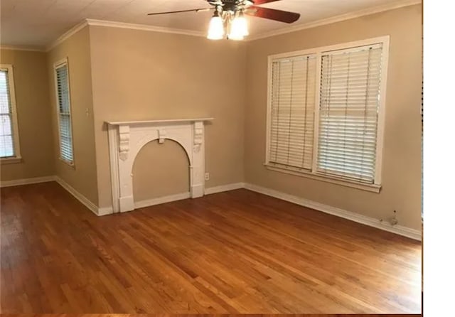 unfurnished living room featuring crown molding, ceiling fan, and hardwood / wood-style floors