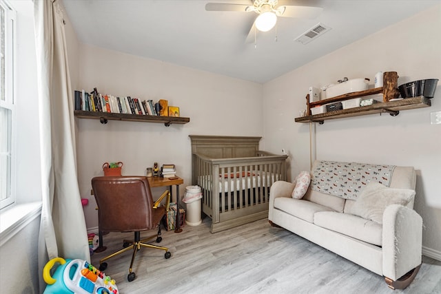 office with ceiling fan and light hardwood / wood-style floors