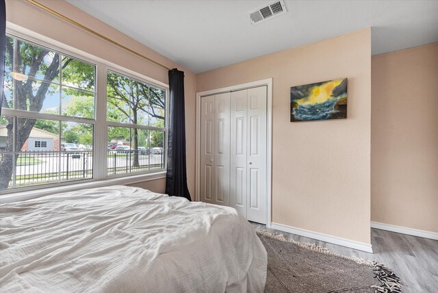 bedroom featuring a closet and hardwood / wood-style floors