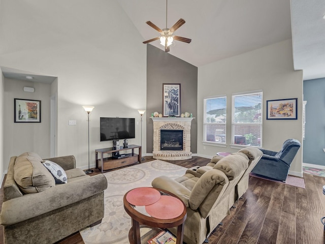 living room featuring ceiling fan, dark wood-type flooring, and high vaulted ceiling