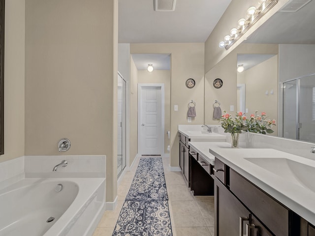 bathroom with vanity, shower with separate bathtub, and tile patterned floors