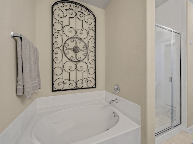 bathroom with tile patterned floors and separate shower and tub