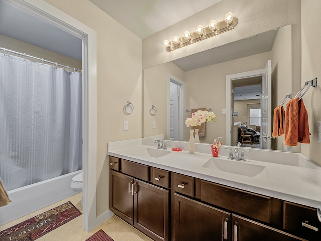 full bathroom featuring shower / bath combination with curtain, tile patterned floors, toilet, and vanity