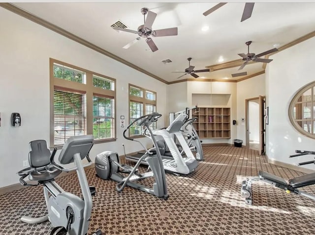 workout area with ornamental molding and carpet floors