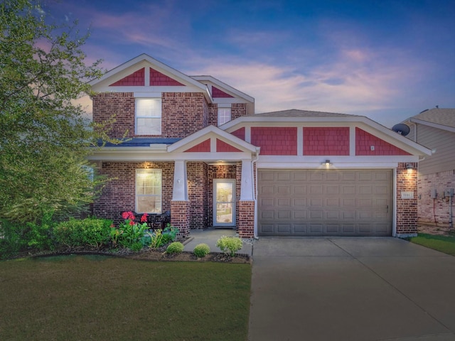 craftsman-style house with a yard and a garage