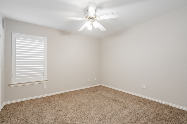 unfurnished room featuring ceiling fan and carpet floors