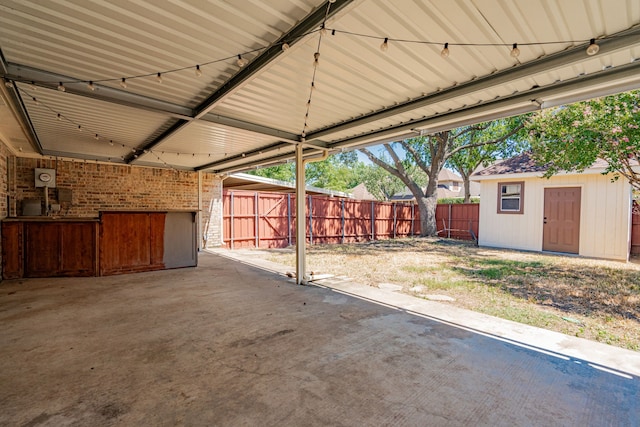 view of patio / terrace with a storage shed