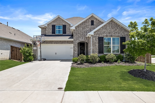 view of front of home featuring a garage and a front lawn