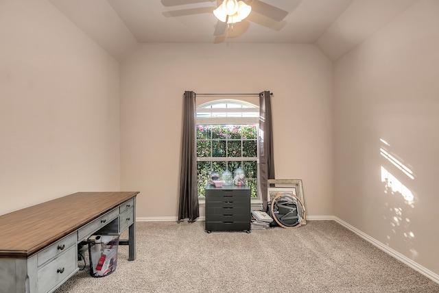 carpeted office with lofted ceiling and ceiling fan