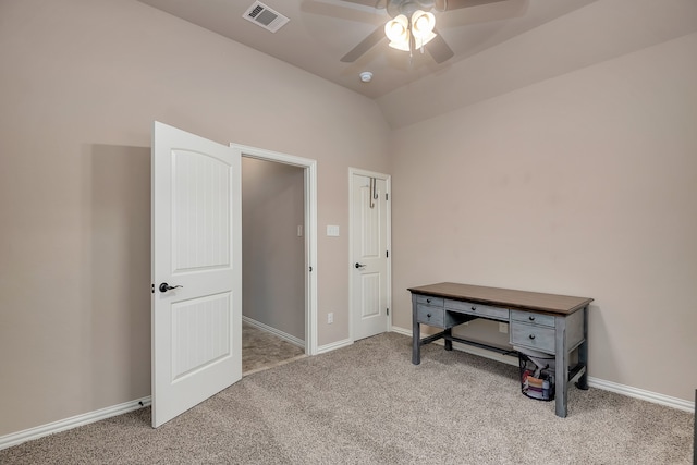 interior space with light carpet, vaulted ceiling, and ceiling fan