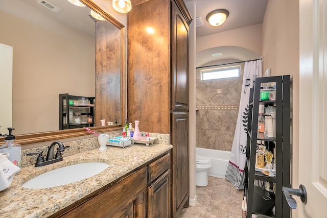 full bathroom featuring shower / bathtub combination with curtain, vanity, and toilet