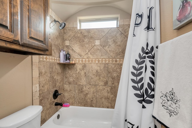 bathroom with shower / bath combo with shower curtain and toilet