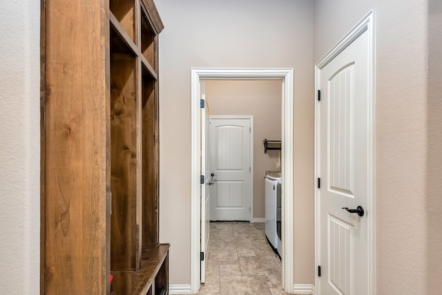 mudroom with washing machine and dryer