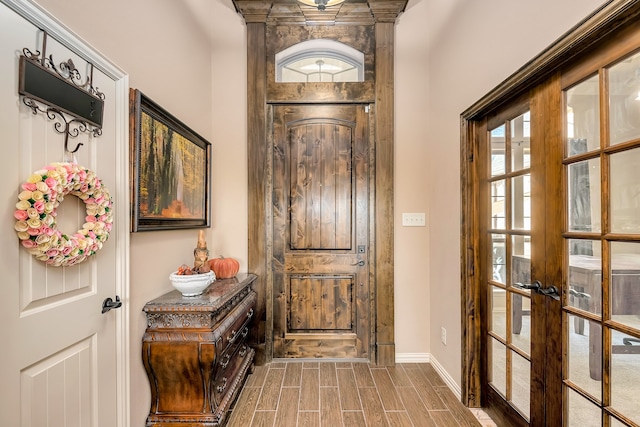 doorway to outside with french doors and light hardwood / wood-style floors