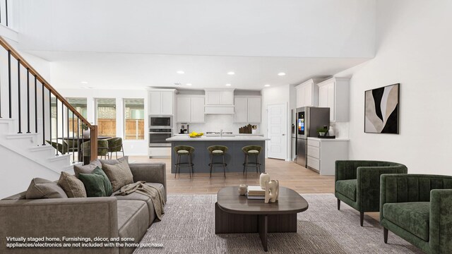 unfurnished living room with light wood-type flooring