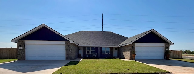 view of front facade featuring a garage and a front lawn