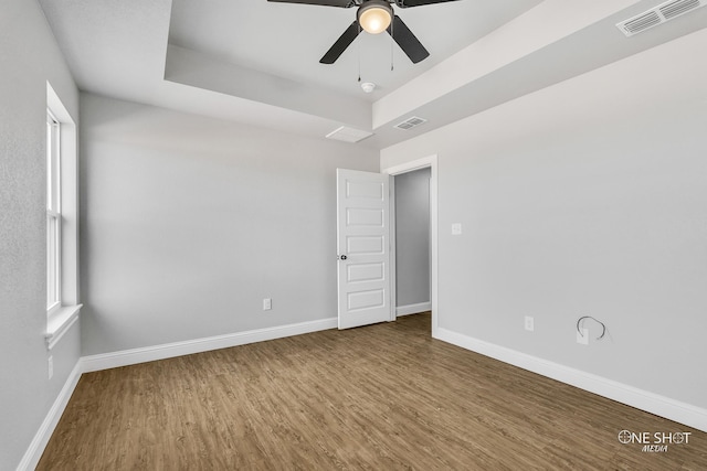 spare room with wood-type flooring and ceiling fan