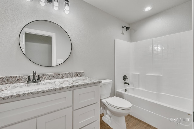 full bathroom with toilet, shower / washtub combination, vanity, and wood-type flooring