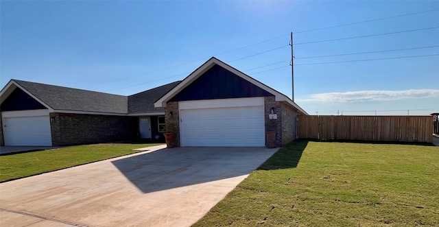 ranch-style home with a front lawn and a garage