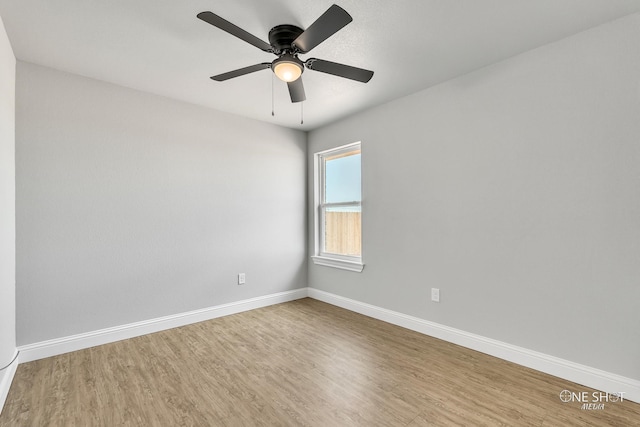 unfurnished room featuring hardwood / wood-style floors and ceiling fan