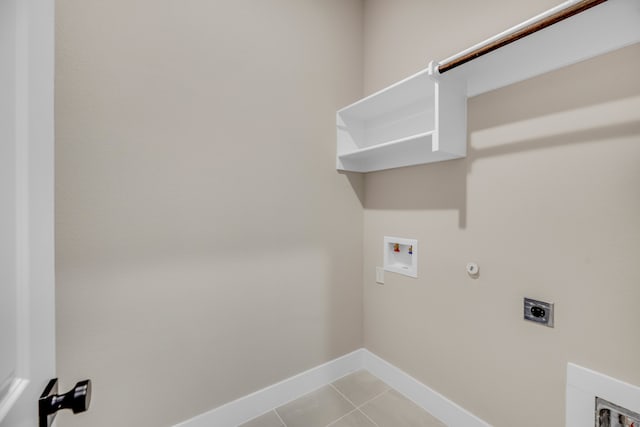 laundry room featuring gas dryer hookup, light tile patterned floors, hookup for an electric dryer, and washer hookup