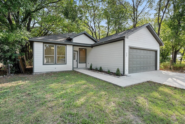 ranch-style house with a garage and a front yard