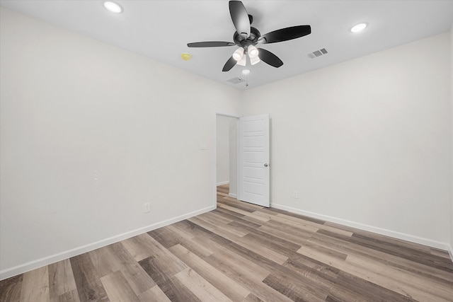 unfurnished room with light hardwood / wood-style floors and ceiling fan