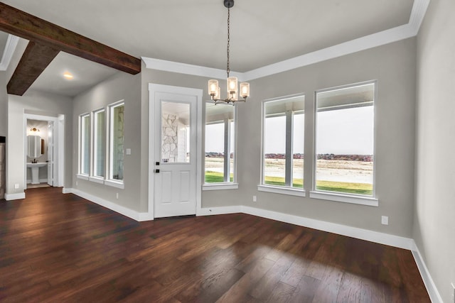 unfurnished dining area featuring beam ceiling, crown molding, a chandelier, and dark hardwood / wood-style floors