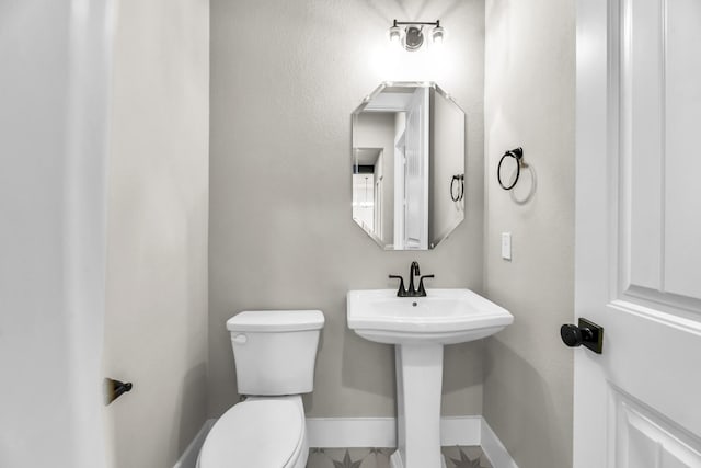 bathroom with toilet and sink