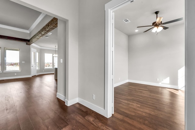 empty room with crown molding, ceiling fan with notable chandelier, and dark hardwood / wood-style floors