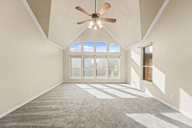 unfurnished living room with carpet floors, ceiling fan, crown molding, and high vaulted ceiling