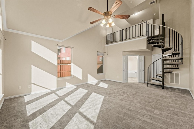 unfurnished living room with carpet, ceiling fan, ornamental molding, and high vaulted ceiling