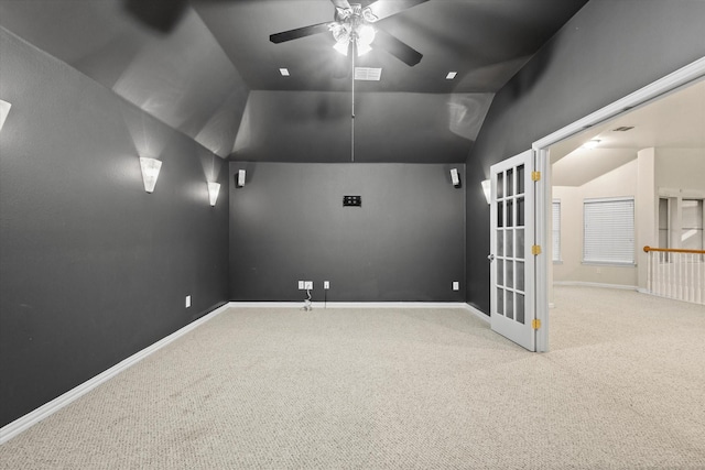 carpeted cinema featuring vaulted ceiling and ceiling fan