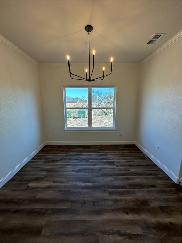 unfurnished dining area with dark hardwood / wood-style flooring, crown molding, and a chandelier