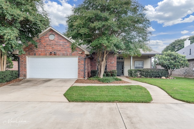 view of front facade with a garage and a front yard