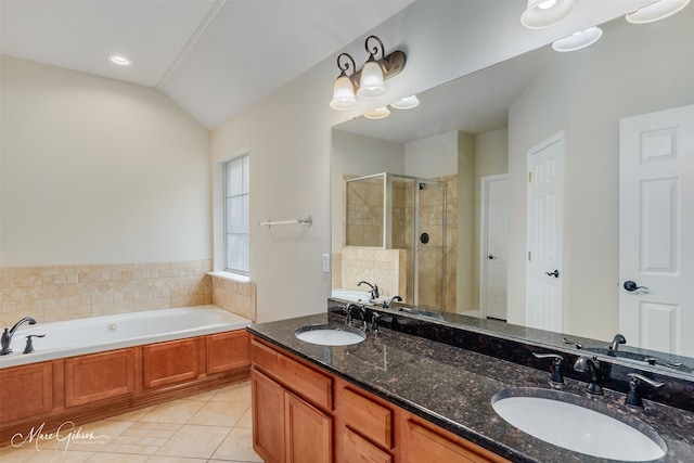 bathroom with vanity, tile patterned flooring, plus walk in shower, and lofted ceiling