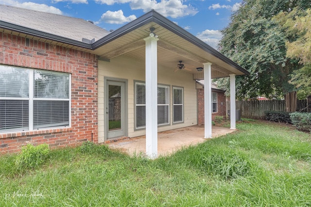 exterior space with a lawn, a patio area, and ceiling fan