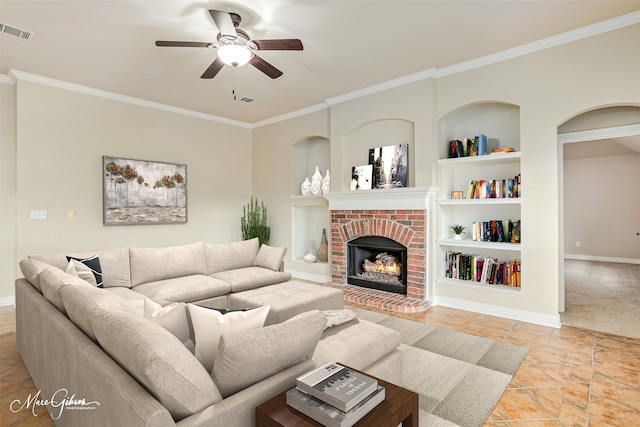 living room with built in shelves, light colored carpet, ceiling fan, crown molding, and a fireplace