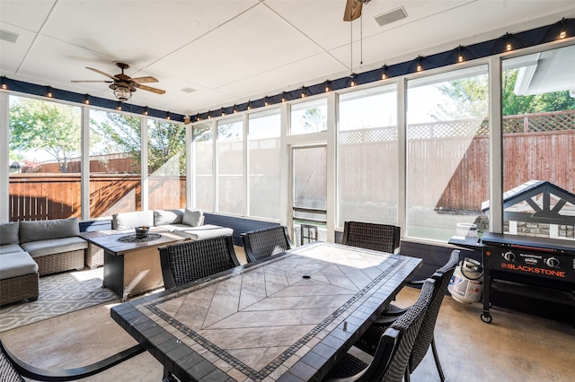 sunroom / solarium with ceiling fan