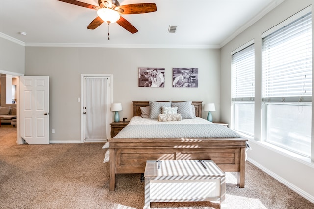 bedroom featuring ornamental molding, ceiling fan, and light colored carpet