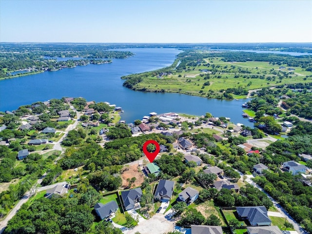drone / aerial view featuring a residential view and a water view