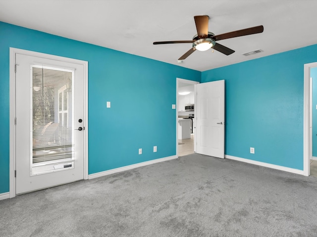 carpeted empty room with ceiling fan