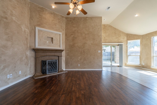 unfurnished living room with ceiling fan, wood-type flooring, and high vaulted ceiling