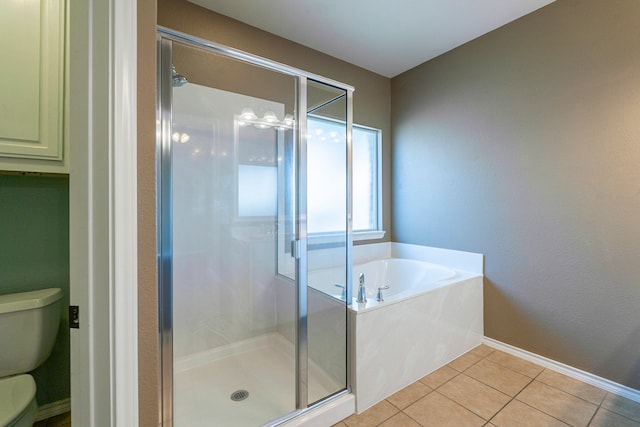 bathroom with shower with separate bathtub, tile patterned flooring, and toilet