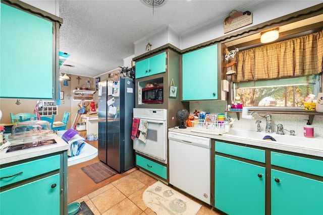 kitchen featuring ornamental molding, white appliances, a textured ceiling, light tile patterned floors, and sink