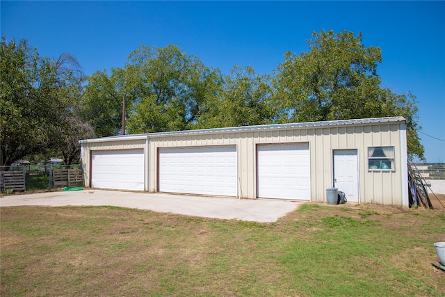 garage featuring a yard